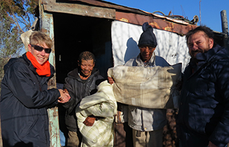 CUDO volunteers distributing clothing